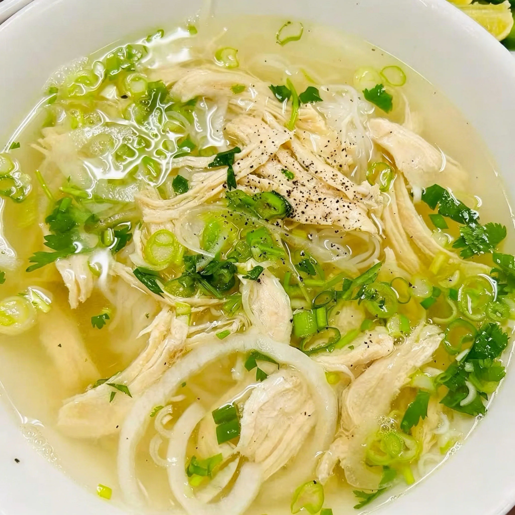 Shredded chicken pho rice noodle soup green onion cilantro pepper clear soup bowl at Su's Asian Street Kitchen, an Asian Fusion Restaurant in Westlake